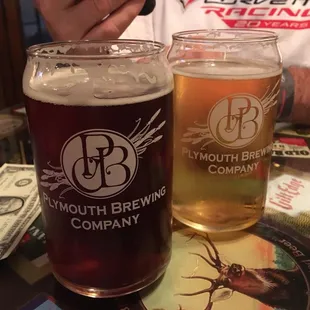 two glasses of beer on a table