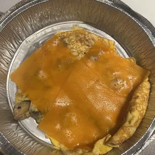 an omelet with cheese on it