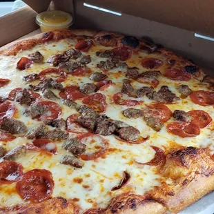 A large sausage and pepperoni pizza
