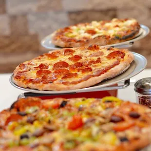 Pepperoni, speciality deluxe, cheese brick oven pizza