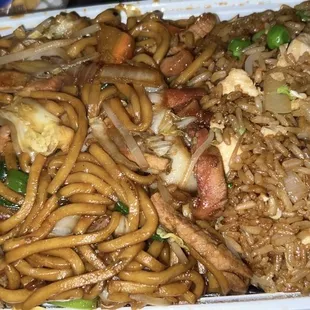 a plate of noodles with meat and vegetables