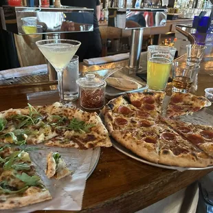 At bar, wood burning pizza oven at back with pizza guy you can talk to , sorry I didn't get a photo, next time