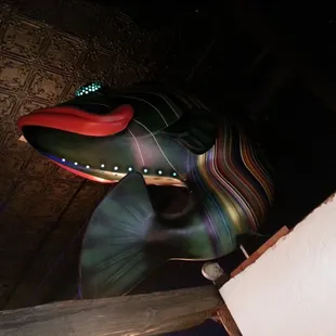 a large fish head on a wall