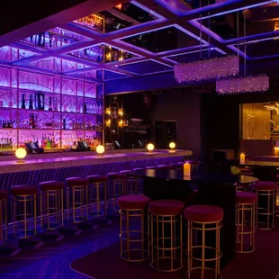 a bar with purple lighting