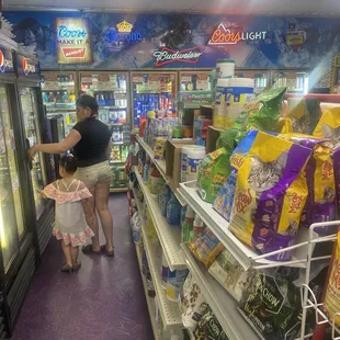 a woman and child in a grocery store