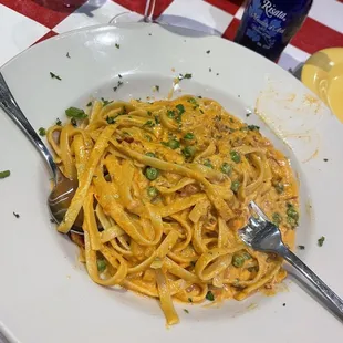 Vodka pasta with pancetta and peas