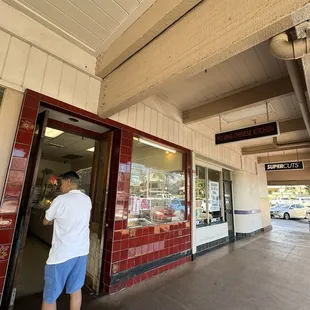 a man entering a restaurant