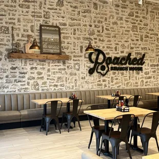 This exposed brick wall is attractive and the restaurant is clean and nicely decorated.