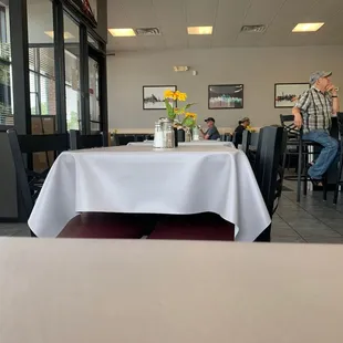 people sitting at tables in a restaurant
