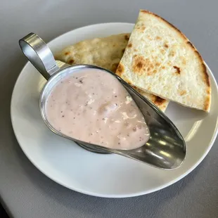 Greek dressing and pita bread for Greek salad.