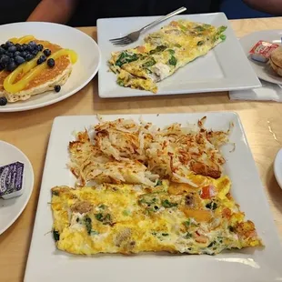 2 veggies omelettes, blueberry lemon pancake on the side