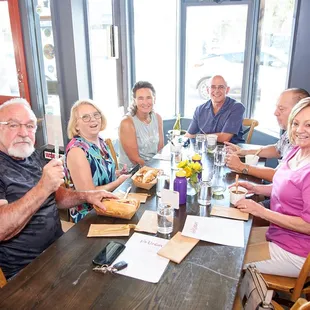 a group of people sitting at a table