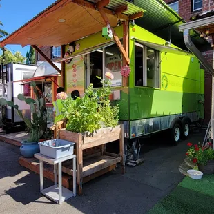 a bright green food truck