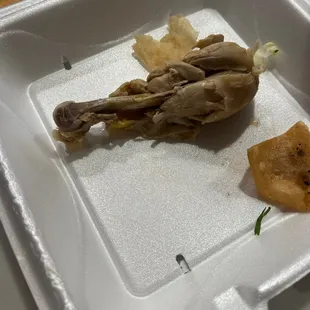 a piece of food in a styrofoam container