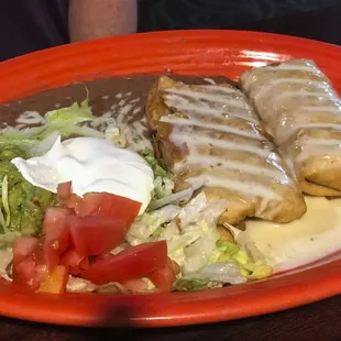 Dos Chimichangas ($10) were nicely fried, covered in runny cheese and stuffed with flavorful shredded chicken.