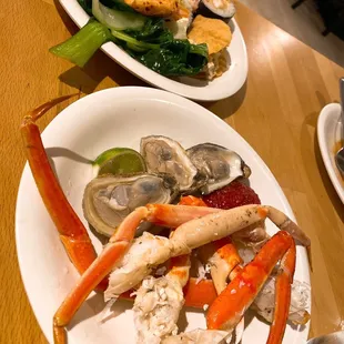 crab legs, crab legs, clams, and crab legs