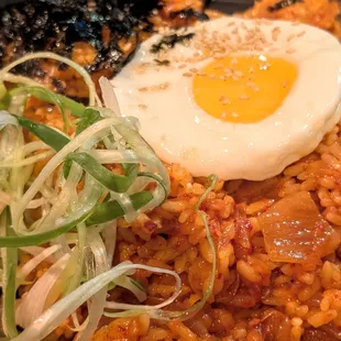 Kimchi fried rice, love the egg, green onions, and seaweed to give the dish some color