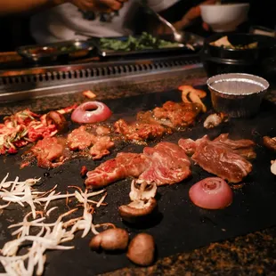 a man preparing food on a grill