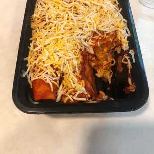 Only three enchiladas. They used to stuff five in here, then it became four, now it&apos;s three.