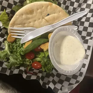 Grilled chicken pocket sandwich with side salad