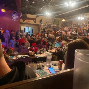 a crowd of people sitting at tables