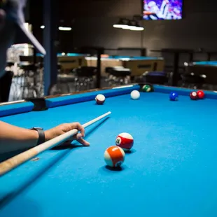 a man playing pool