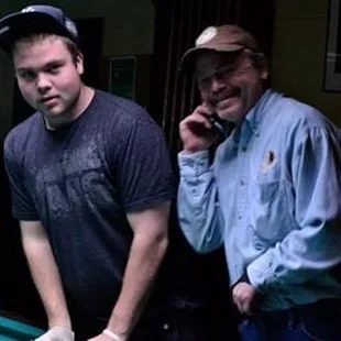 two men playing pool