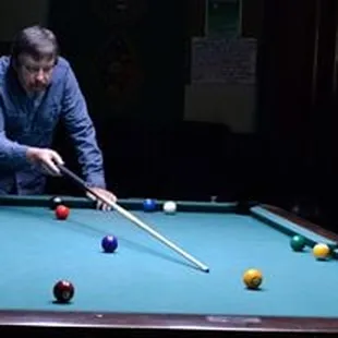 a man playing pool