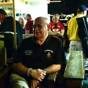 a group of people sitting in a restaurant