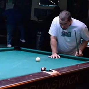 a man playing pool