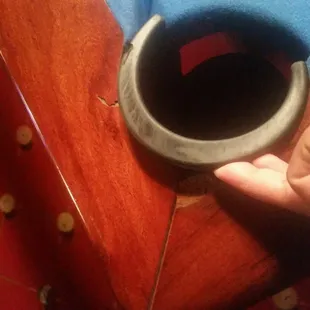 a hand holding a cup