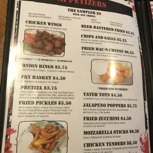 a menu for a restaurant with chicken wings and fries