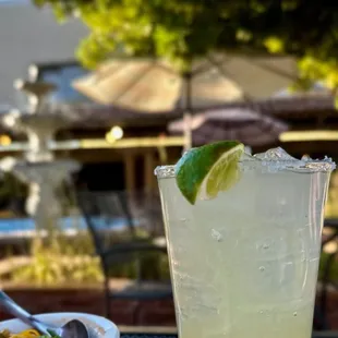 a glass of lemonade and a plate of food