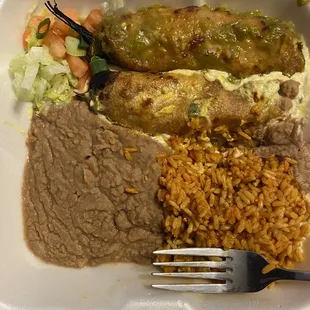 Two Chile rellano plate.  One with sour cream green Chile sauce, One with green chili sauce.  . Rellanos were too heavily breaded.
