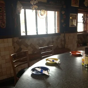 No tables but a fun curvy bar to crawl up to