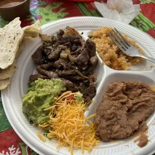Fajita plate with rice beans and guac. And one tortilla but I asked for one extra. It was delicious and it hit the spot!