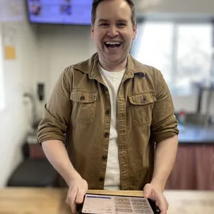 This super friendly bastard takes your order, bags your goods, takes your cash and throws in a couple of treats each time.  Respect!