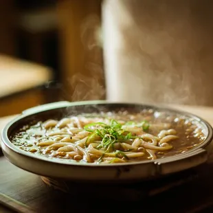 steam rising from a bowl of noodles