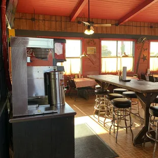 Seating area with self serve drink station.