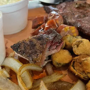 Grilled onion small bite of brisket hominy