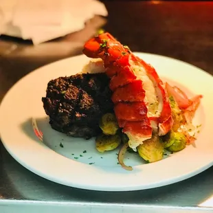 a plate of meat and vegetables