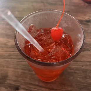 a drink with a cherry on top