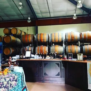 wine barrels stacked on shelves