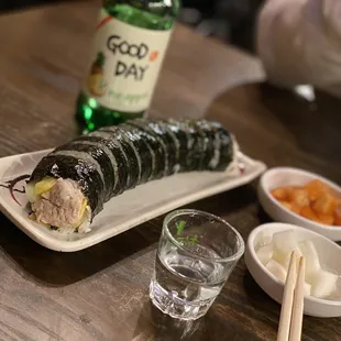 Tuna kimbap, side dishes and pineapple soju