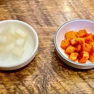 a bowl of yogurt and a bowl of chopped carrots