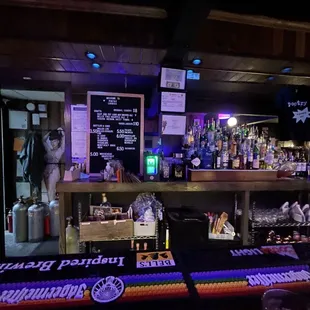 a bar with a variety of drinks