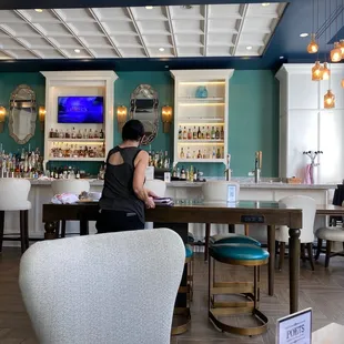 a woman sitting at a bar