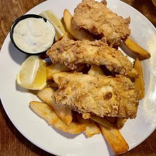 a plate of fried fish and fries