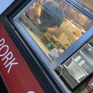 a man behind a window