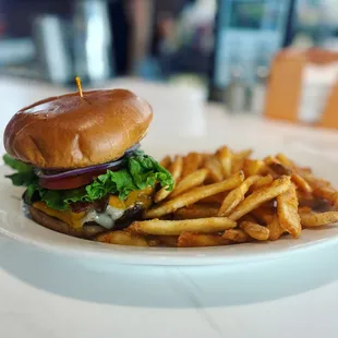 a burger and fries on a plate